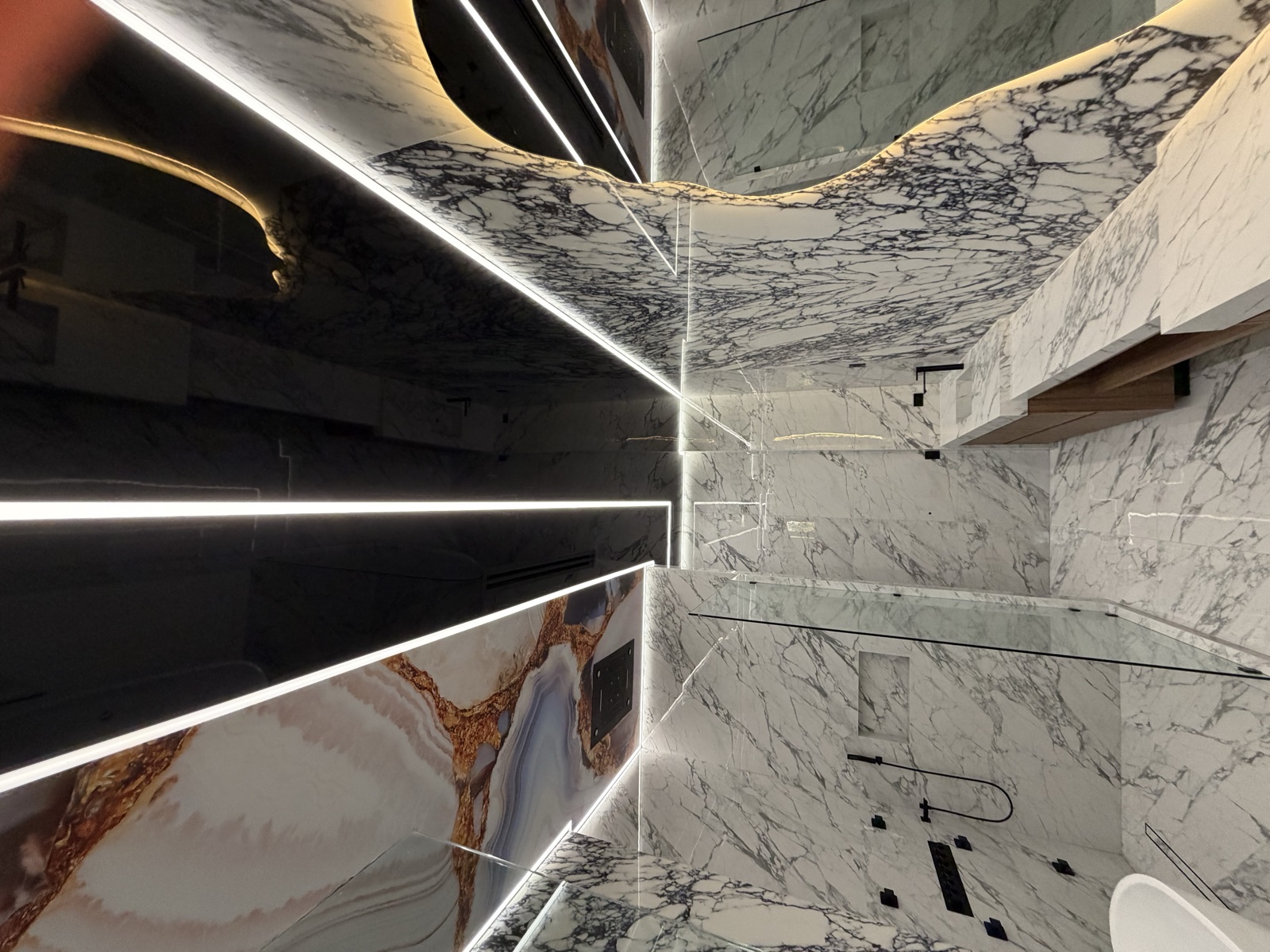 Marble bathroom with crossing LED ceiling accents
