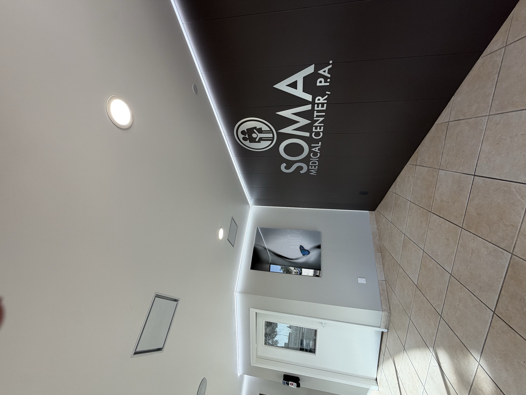 SOMA Medical Center — branded stretch ceiling wall panel